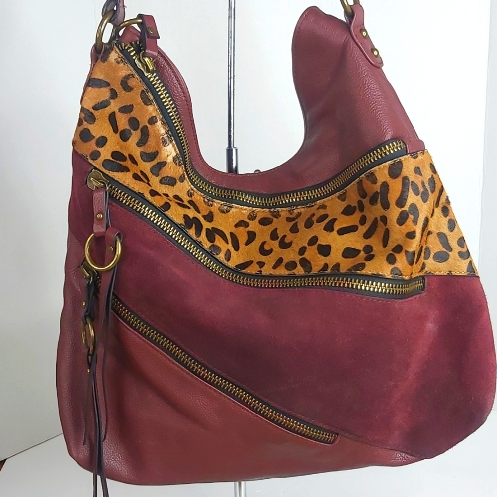 Sharif designed in New York burgundy satchel handbag.Measurements on strap 8 1/2